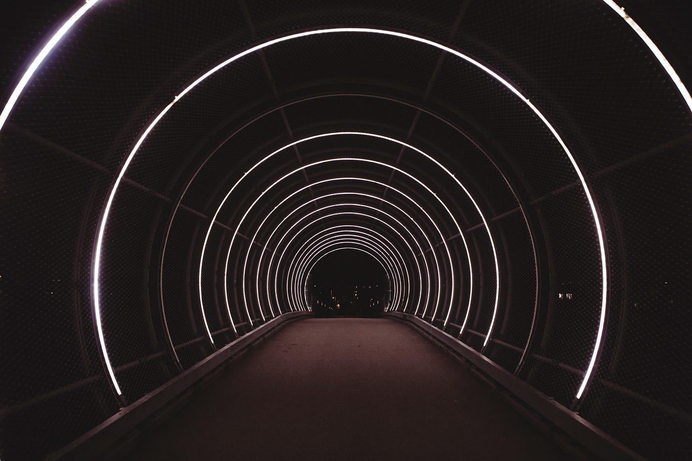 Looking down a long lit tunnel